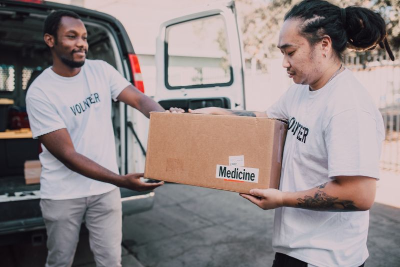 Volunteers packing food boxes for distribution
